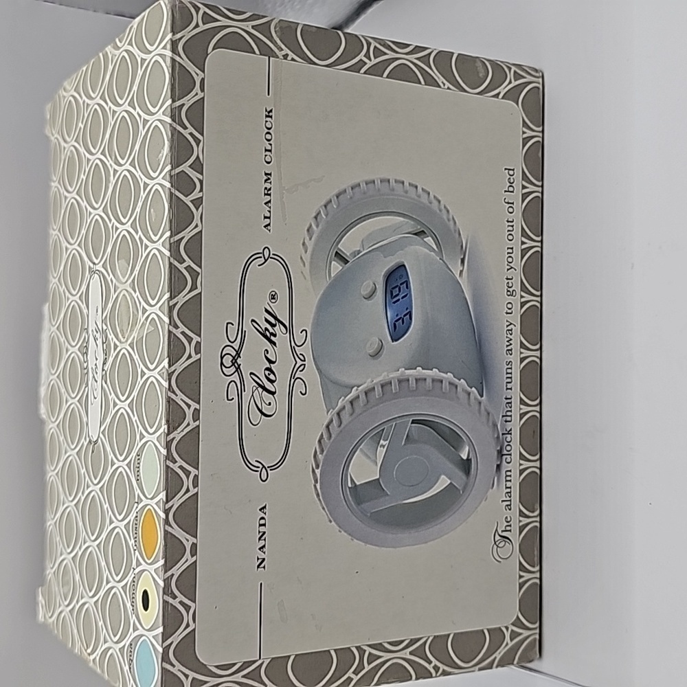 Clocky alarm on set of wheels rolls around gets child out of bed to shut off - Picture 4 of 6